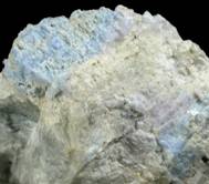 Mineral Specimens: Carletonite (MSH UK-15) in Pectolite from Poudrette Quarry, Mont Saint-Hilaire, Québec, Canada